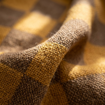 Close-up of the woven checkerboard texture in Ochre & Brown